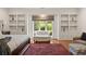 Close-up of the main bedroom sitting area with a plush rug and light-filled windows at 1178 Roxboro Ne Cv, Atlanta, GA 30324
