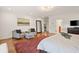 Full view of the main bedroom showcases hardwood floors, furniture, and natural light at 1178 Roxboro Ne Cv, Atlanta, GA 30324