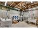 Utility area with water filtration system, laundry tub, and washer hookup in the unfinished basement at 2251 Nancy Creek Dr, Atlanta, GA 30341