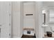 Convenient half-bathroom with a pedestal sink and charming decorative accents on the walls at 2251 Nancy Creek Dr, Atlanta, GA 30341