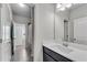 Clean bathroom with a single vanity, large mirror, and a combination shower-tub with light-colored tile at 2251 Nancy Creek Dr, Atlanta, GA 30341