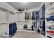 Large walk-in closet with custom shelving and hanging rods, providing optimal organization and storage space at 2251 Nancy Creek Dr, Atlanta, GA 30341