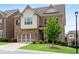 Attractive two-story brick home featuring a manicured lawn, two-car garage, and classic design elements at 2251 Nancy Creek Dr, Atlanta, GA 30341