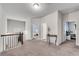 Second floor hallway with iron railing and several doorways leading to bedrooms at 2251 Nancy Creek Dr, Atlanta, GA 30341