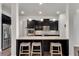 Bright eat-in kitchen features a granite island with pendant lighting and stainless steel appliances at 2251 Nancy Creek Dr, Atlanta, GA 30341