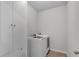 Bright laundry room with modern washer and dryer, plus convenient storage cabinets at 2251 Nancy Creek Dr, Atlanta, GA 30341