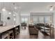 Open-concept living area with hardwood floors, a kitchen bar, and a seamless flow to the dining space at 2251 Nancy Creek Dr, Atlanta, GA 30341