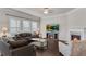 Comfortable living room features a fireplace, large windows, and ample seating, perfect for relaxation at 2251 Nancy Creek Dr, Atlanta, GA 30341
