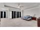 Spacious main bedroom featuring a ceiling fan and black curtains, filled with natural light at 2251 Nancy Creek Dr, Atlanta, GA 30341