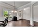 Versatile front room bathed in natural light, featuring hardwood floors, neutral tones, and space for an office at 2251 Nancy Creek Dr, Atlanta, GA 30341