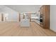 Open concept kitchen with large center island, stainless appliances, and wood and white cabinetry at 535 Shamrock Dr, Cumming, GA 30040