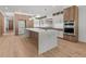 Modern kitchen with center island, stainless appliances, and custom cabinets at 535 Shamrock Dr, Cumming, GA 30040
