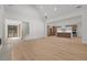 Open concept living room with vaulted ceilings, hardwood floors, and view of modern kitchen at 535 Shamrock Dr, Cumming, GA 30040