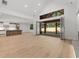 Open concept living room features soaring ceilings and folding doors to covered patio at 535 Shamrock Dr, Cumming, GA 30040