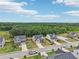Street view featuring well-maintained homes, manicured lawns, and tree-lined streets in a suburban community at 537 Daffodil Ln, Mcdonough, GA 30253