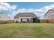 Home's large backyard features a pergola and enclosed porch at 537 Daffodil Ln, Mcdonough, GA 30253