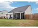 Home's backyard features a patio, pergola and enclosed porch at 537 Daffodil Ln, Mcdonough, GA 30253