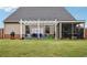 Spacious backyard featuring a covered patio and pergola, perfect for gatherings at 537 Daffodil Ln, Mcdonough, GA 30253