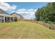 Wide angle of the spacious backyard features a patio and pergola at 537 Daffodil Ln, Mcdonough, GA 30253