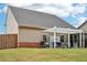 Exterior view of a backyard that features both an enclosed patio and pergola at 537 Daffodil Ln, Mcdonough, GA 30253