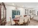 Formal dining room features a wood table with seating for six and sliding glass doors to the outdoor living space at 537 Daffodil Ln, Mcdonough, GA 30253