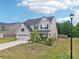 Beautiful home with a manicured lawn, two-car garage, tasteful landscaping, and a welcoming front porch at 537 Daffodil Ln, Mcdonough, GA 30253