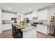 Bright, airy kitchen with stainless appliances, granite countertops, white cabinets and seating for four at the bar at 537 Daffodil Ln, Mcdonough, GA 30253