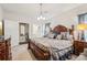 This main bedroom features a luxurious bed frame, plush bedding, and elegant furnishings at 537 Daffodil Ln, Mcdonough, GA 30253