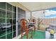Cozy screened-in patio with seating area, accessible from sliding glass door at 537 Daffodil Ln, Mcdonough, GA 30253