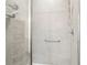 This walk-in shower features tiled walls, glass enclosure, and a convenient grab bar at 537 Daffodil Ln, Mcdonough, GA 30253