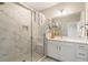 Modern bathroom featuring glass enclosed shower, and white vanity with solid countertops at 933 Catamaran Ct, Alpharetta, GA 30005