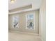 Bright, spacious bedroom featuring a tray ceiling and plenty of natural light at 933 Catamaran Ct, Alpharetta, GA 30005
