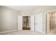 Spacious bedroom with plush carpet, large closet, and ensuite bathroom featuring glass shower doors at 933 Catamaran Ct, Alpharetta, GA 30005