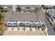 Rear view of modern townhomes featuring private patios, rear-entry garages, and clean architectural lines at 933 Catamaran Ct, Alpharetta, GA 30005