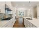 Bright kitchen showcases an open layout, stainless appliances, and a large island at 933 Catamaran Ct, Alpharetta, GA 30005