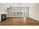 Inviting living room with hardwood floors, fireplace, and bright windows offering lots of natural light at 933 Catamaran Ct, Alpharetta, GA 30005