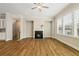Inviting living room with fireplace, recessed lighting, and wood floors at 933 Catamaran Ct, Alpharetta, GA 30005