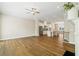 Open-concept area with kitchen featuring wood floors, recessed lighting, and stainless appliances at 933 Catamaran Ct, Alpharetta, GA 30005