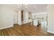 Open-concept living space with hardwood floors connecting the living and kitchen areas, perfect for entertaining at 933 Catamaran Ct, Alpharetta, GA 30005