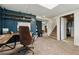 Finished basement features an office area with dark blue walls and carpeted floors at 1154 Pair Sw Rd, Marietta, GA 30060
