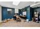 Finished basement space with an office area featuring a desk, shelves, and dark blue walls at 1154 Pair Sw Rd, Marietta, GA 30060