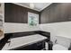Bathroom offers a soaking tub, modern fixtures, and bold wallpaper at 1154 Pair Sw Rd, Marietta, GA 30060