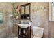 Modern bathroom with stone tiled walls, glass shower, and dark wood vanity with storage at 1154 Pair Sw Rd, Marietta, GA 30060