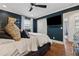 Comfortable dark-walled bedroom features a ceiling fan and closet storage at 1154 Pair Sw Rd, Marietta, GA 30060