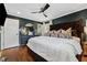 Elegant dark-walled bedroom features hardwood floors, ceiling fan, and ensuite bathroom at 1154 Pair Sw Rd, Marietta, GA 30060
