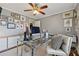 Bedroom space features a glass desk, ceiling fan, and plenty of wall decor at 1154 Pair Sw Rd, Marietta, GA 30060