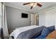 Bright bedroom with white trim, ceiling fan, and a television on the wall at 1154 Pair Sw Rd, Marietta, GA 30060