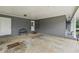Carport featuring a gray brick wall, a metal bench, and white accents at 1154 Pair Sw Rd, Marietta, GA 30060