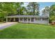 Charming single-story home with a well-manicured lawn and convenient carport at 1154 Pair Sw Rd, Marietta, GA 30060