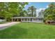 Charming single-story home with a well-manicured lawn and convenient carport at 1154 Pair Sw Rd, Marietta, GA 30060